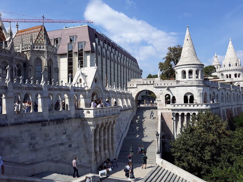 Budapest: Buda Castle Walking Tour & Folk Music Performance - Matthias Church and the first look at Castle Hill