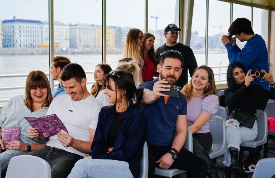 Budapest: Nighttime or Daytime Sightseeing Cruise - Inside the boat: seating, screens, and audio